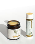 Open jar and stick of Taspen's Organics Tallow & Botanicals Anti-Aging Balm on a white background.